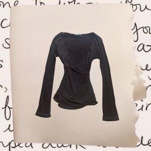 dark brown long sleeve top with flared sleeves